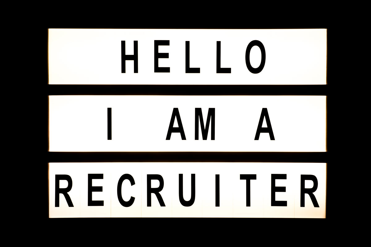lit up sign saying "Hello I am a recruiter"