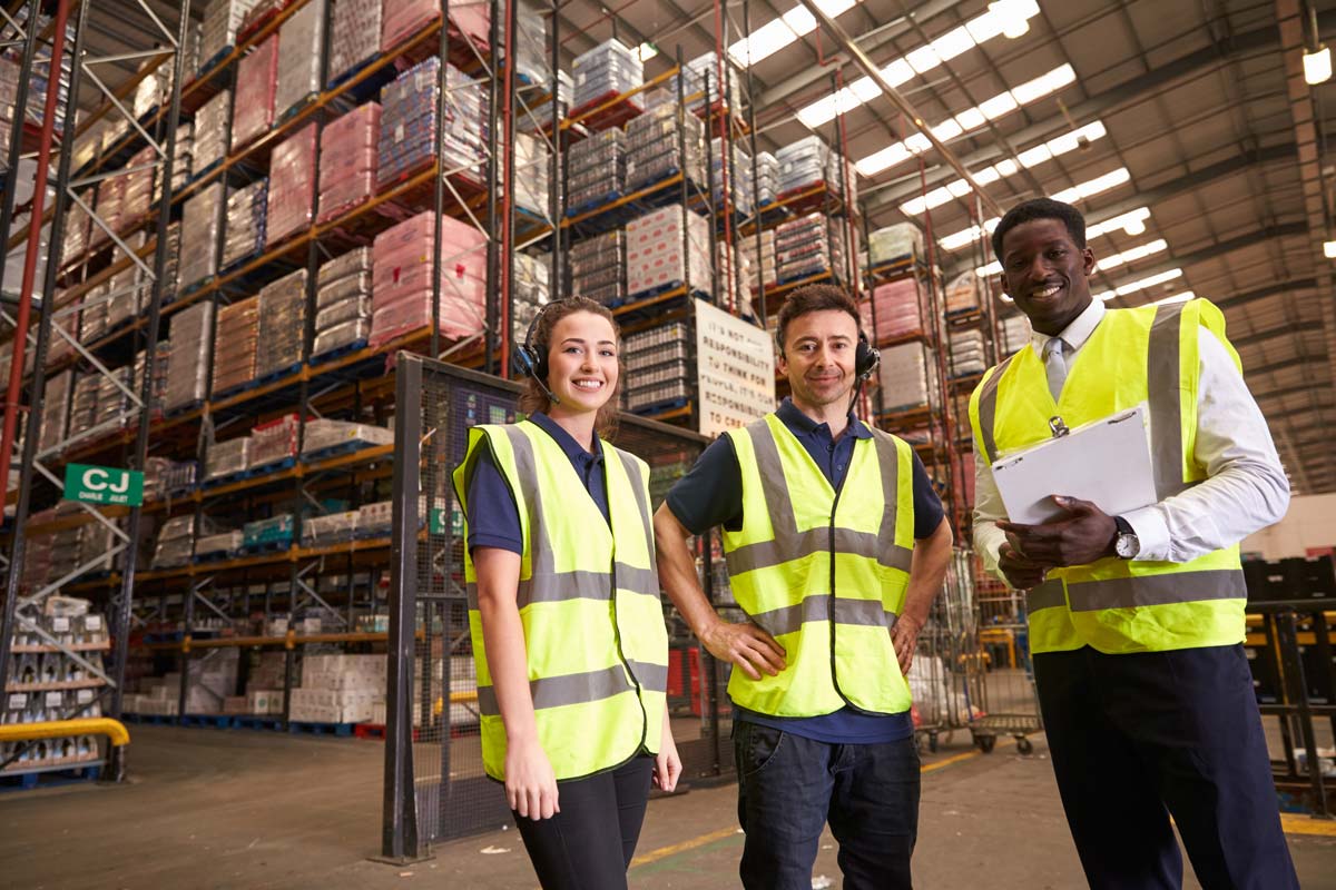 Distribution warehouse manager and colleagues