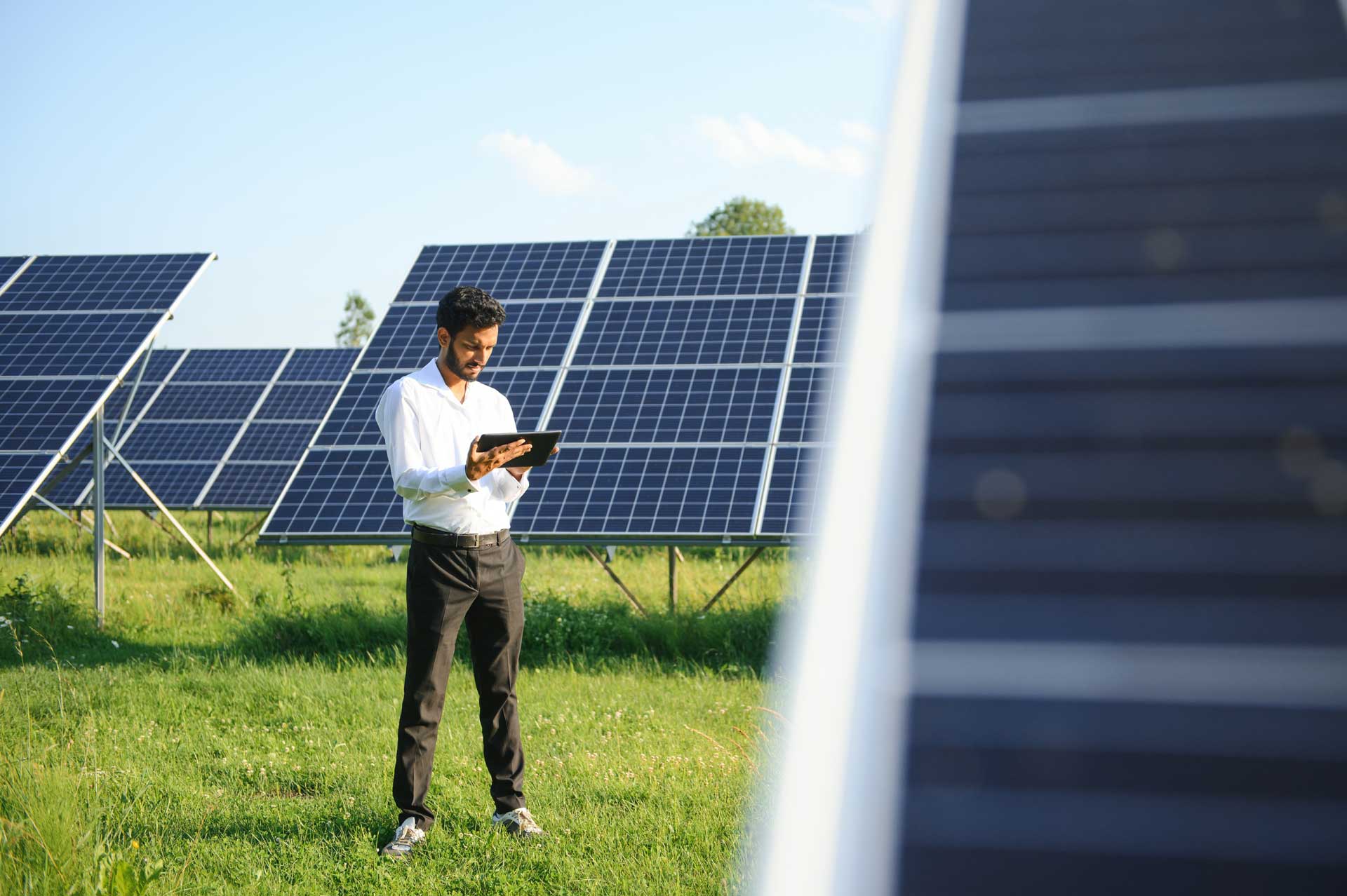 technician or manager standing with solar panel. renewable energy